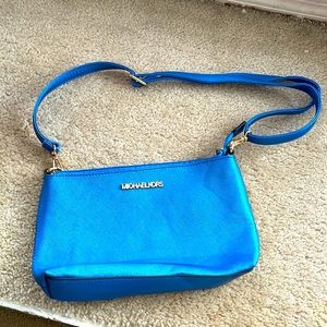 Michael Kors Teal cross body clutch